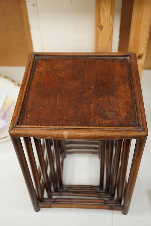 A nest of five Chinese hardwood stands, tallest (largest) 32cm high